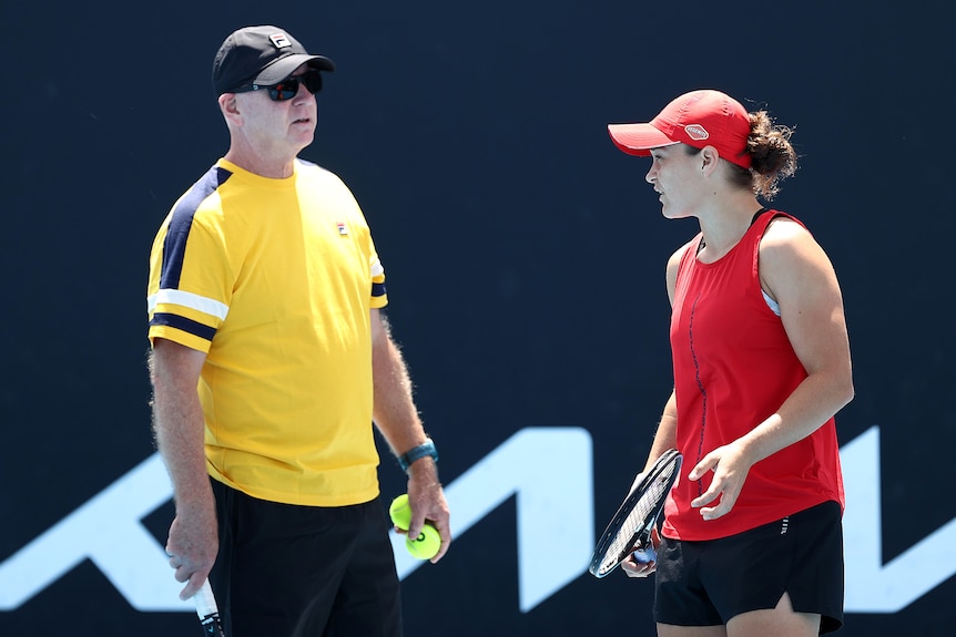 Craig Tyzzer and Ash Barty at a training session at Melbourne Park.