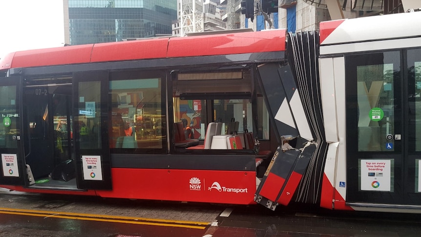 Major damage, including a large hole, can be seen on the side of a tram in Sydney.