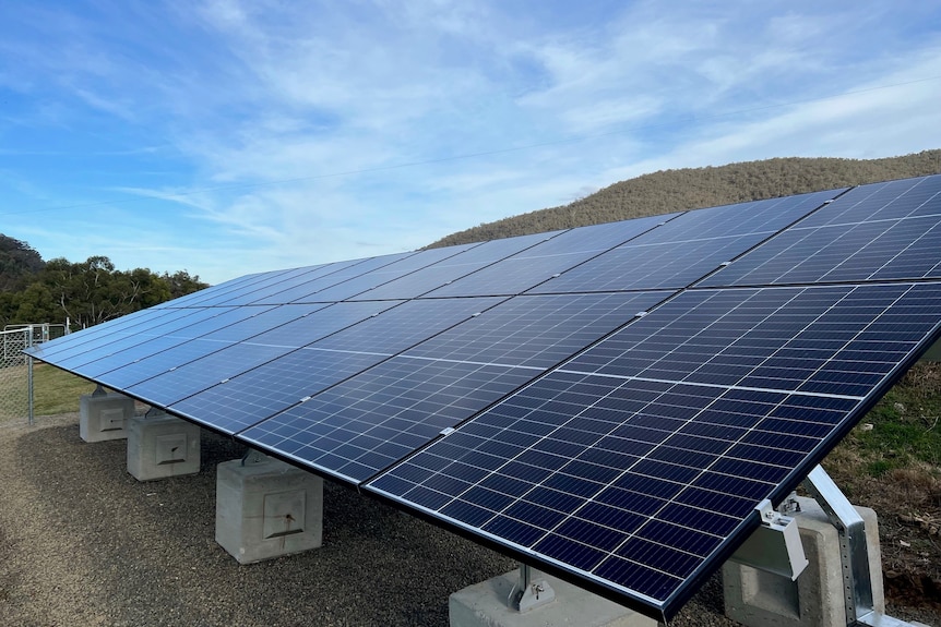 A set of solar panels on a rural property.