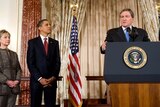 Hillary Clinton and US President Barack Obama listen to Richard Holbrooke