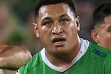 Josh Papalii stands with his hands on his shorts with a stunned look on his face