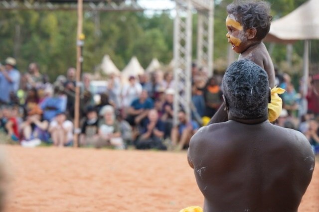 Joevhan Burarrwanga is held up at Garma Festival in the Northern Territory.