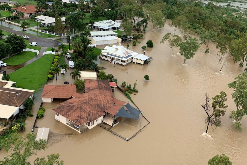 Floodwaters surrounding some homes, as seen from the air