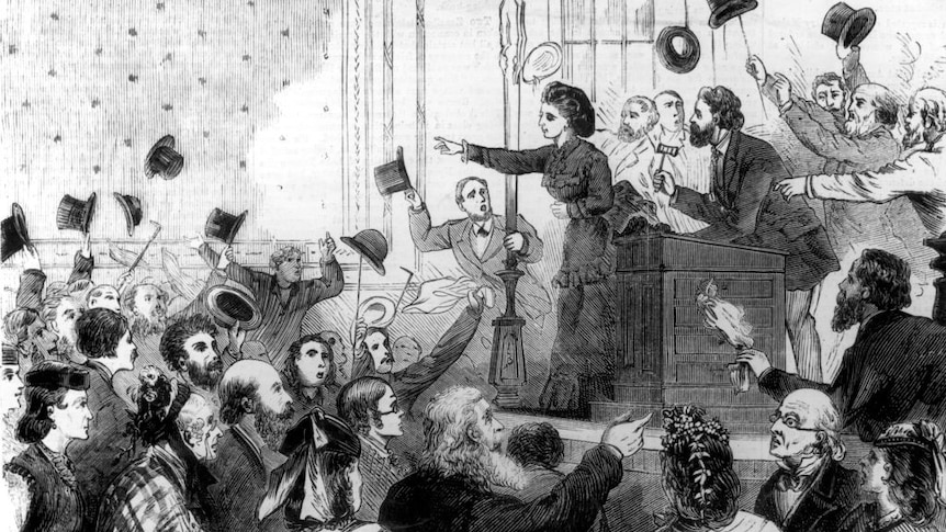 drawing of a Victorian era Victoria Woodhull on stage at a campaign rally with  women and men who are throwing hats in the air