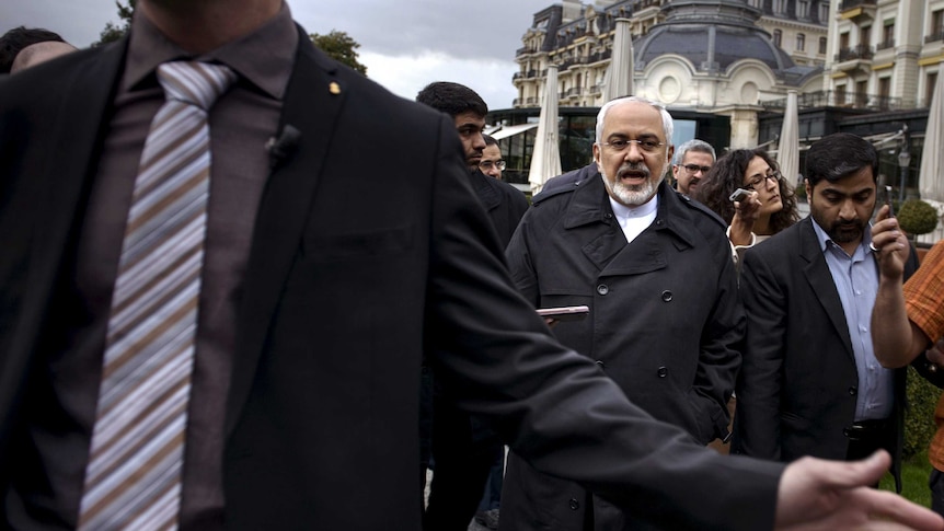 Iran's foreign minister speaks to media during talks in Lausanne