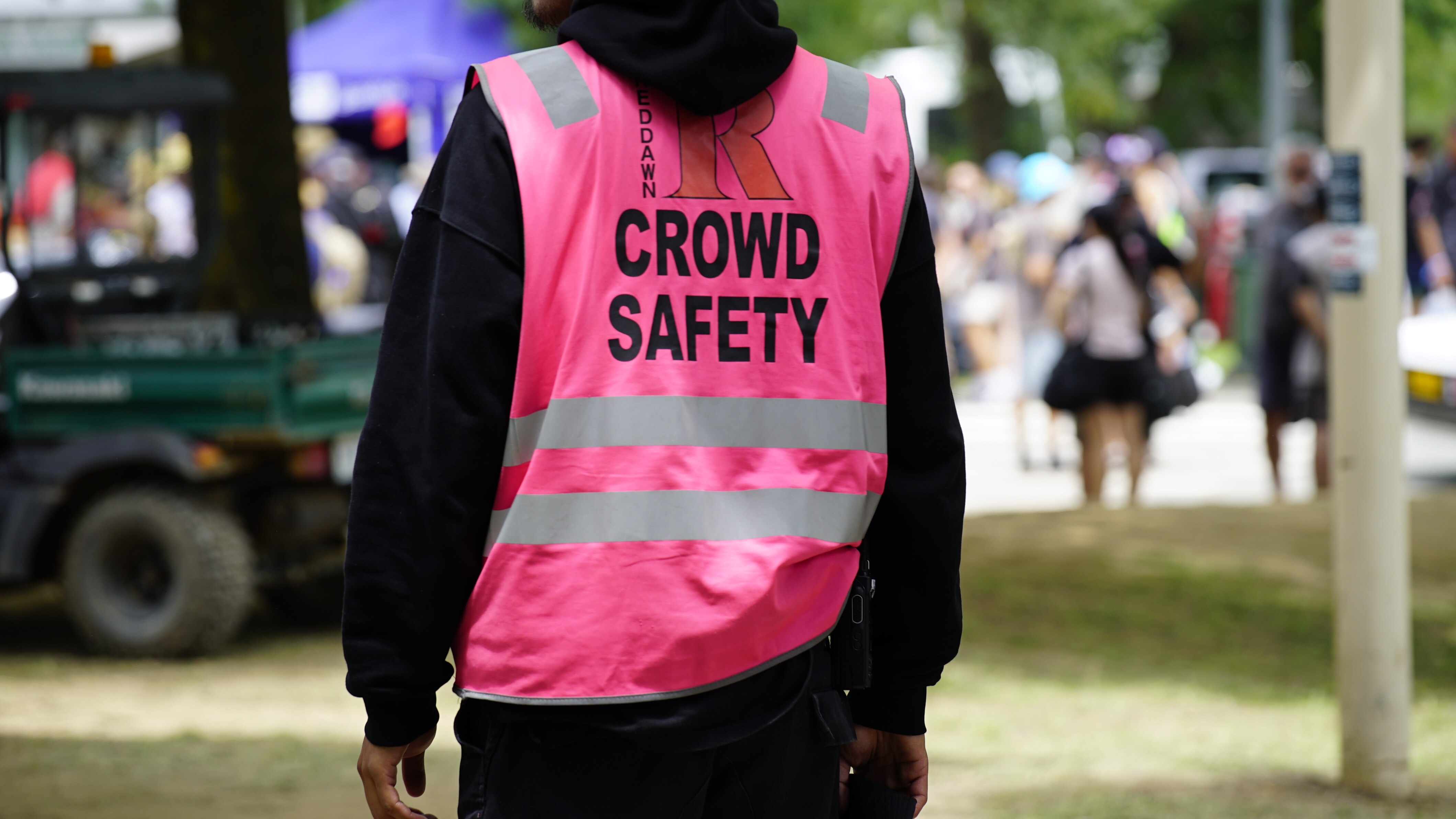 A crowd safety officer looks over the crowd at Summernats 2024 in Canberra.