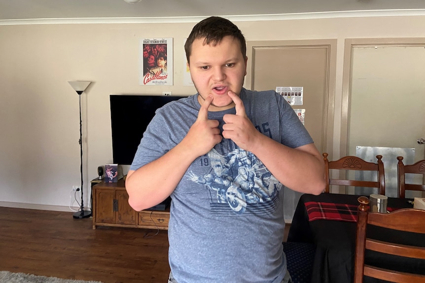 A photo of a boy in a house, the boy has autism spectrum disorder