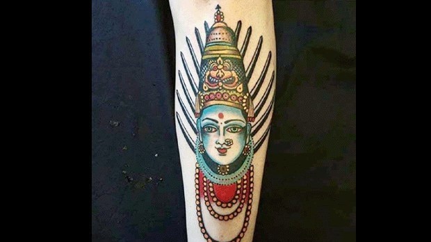 Leg tattoo of Hindu Goddess Yellamma