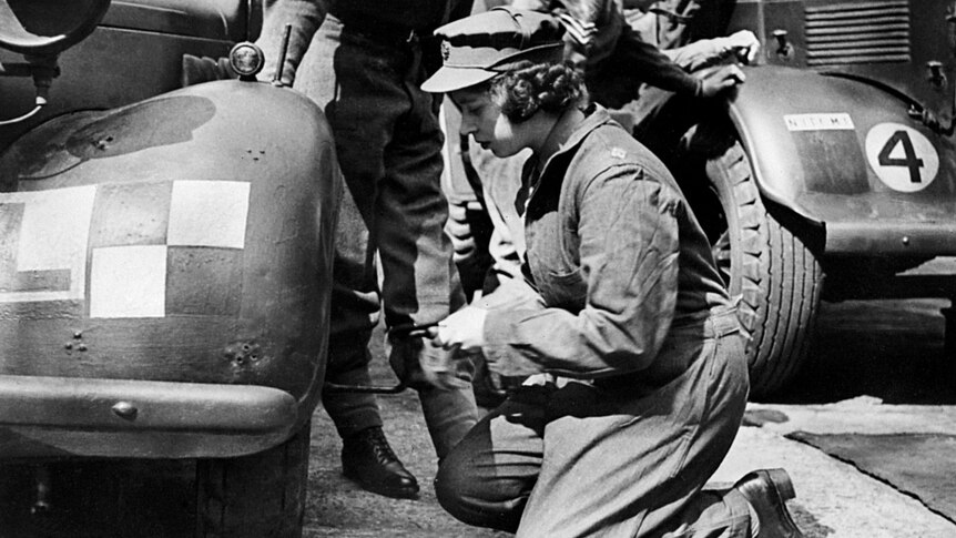 Princess Elizabeth changes the wheel of a military vehicle during the World War II.