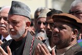 Late Afghan vie president Mohammad Qasim Fahim with president Hamid Karzai