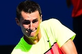 Bernard Tomic hits a back-hand