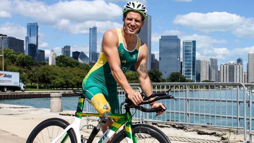 A photo of para-triathlete riding his bike