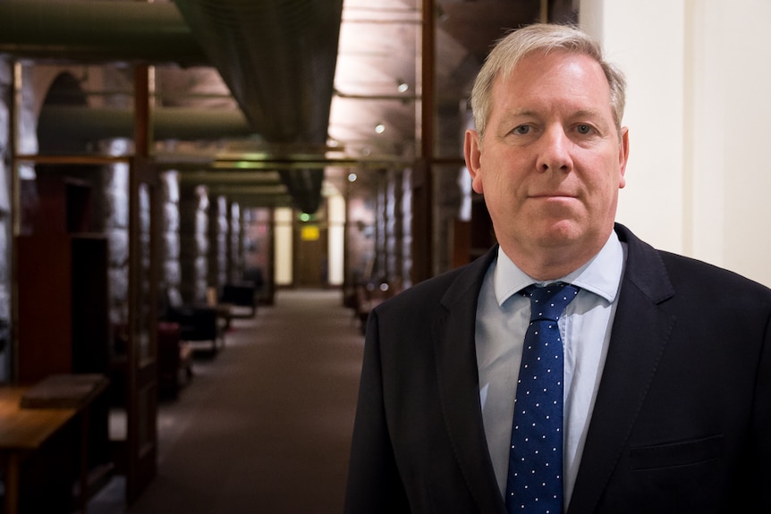 Victoria's shadow transport minister David Davis standing in State Parliament.