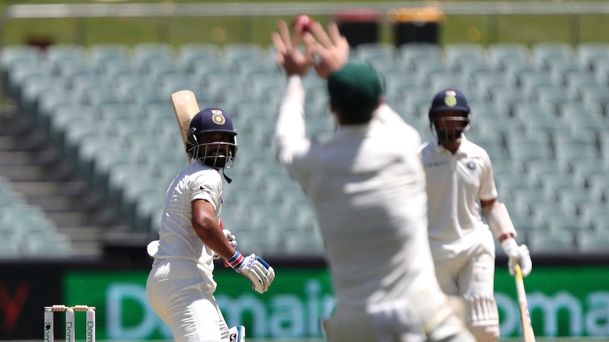 Peter Handscomb takes a catch off Rahane