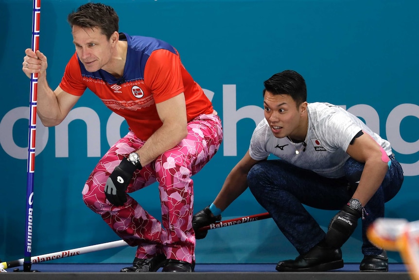 Thomas Ulsrud of Norway competing against Tsuyoshi Yamaguchi in the men's curling at the Olympic Winter Games.