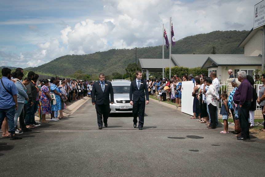 Guard of honour as car exits funeral home