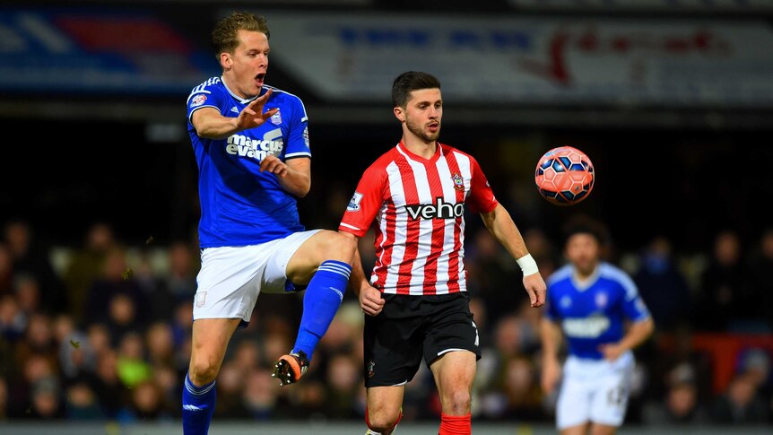 Shane Long battles with Cristophe Berra during the third-round FA Cup clash between Southampton and Ipswich Town