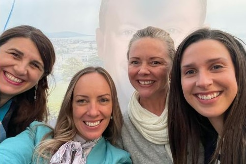 A photo on a Facebook post of four smiling women.