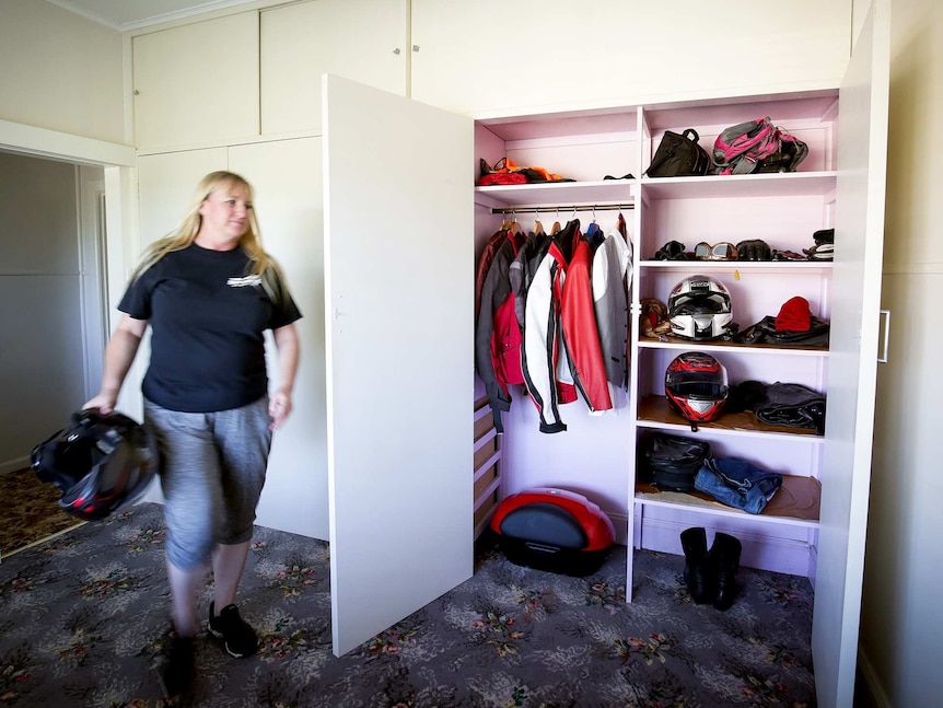 Tracy's cupboard full of leathers and helmets