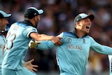 England players dash across the field in celebration after winning the Cricket World Cup final