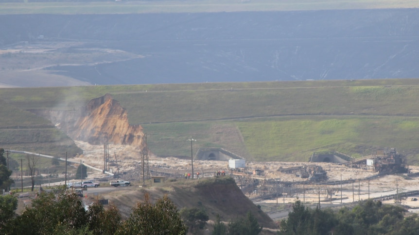 Water flows into the Yallourn open cut coal mine from Morwell River