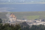 Water flows into the Yallourn open cut coal mine from Morwell River