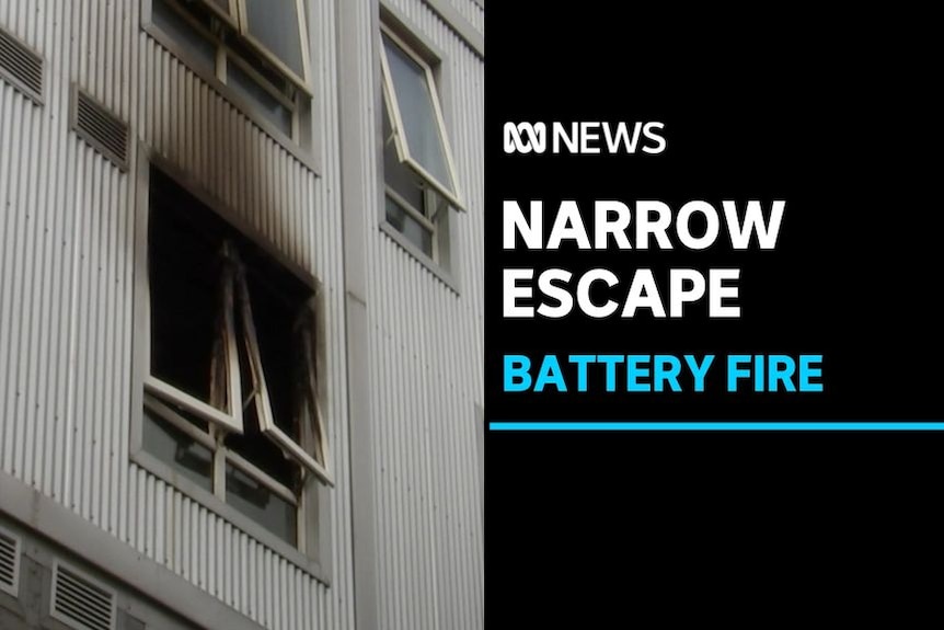 Narrow Escape, Battery Fire: Exterior of a building with a burnt out window.