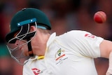 A cricket ball ricochets off Australia batsman Steve Smith's neck during an Ashes Test.