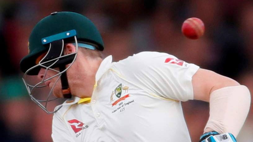 A cricket ball ricochets off Australia batsman Steve Smith's neck during an Ashes Test.