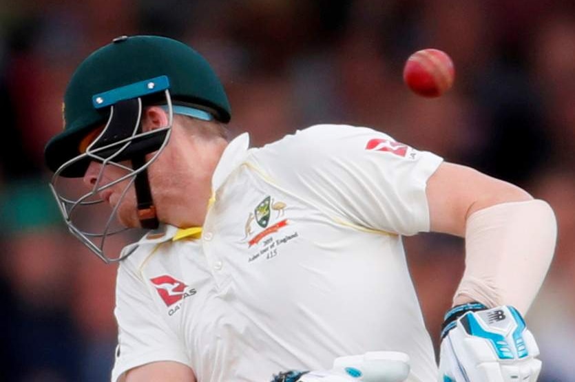 A cricket ball ricochets off Australia batsman Steve Smith's neck during an Ashes Test.