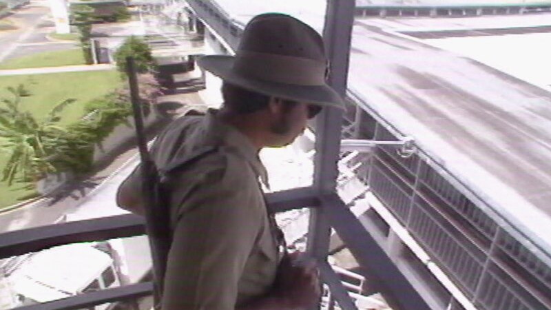 Prison guard with rifle patrols in a tower overlooking Boggo Road jail in Brisbane in 1988.