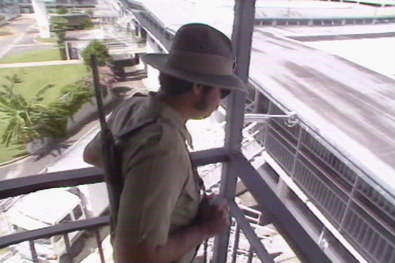 Prison guard with rifle patrols in a tower overlooking Boggo Road jail in Brisbane in 1988.