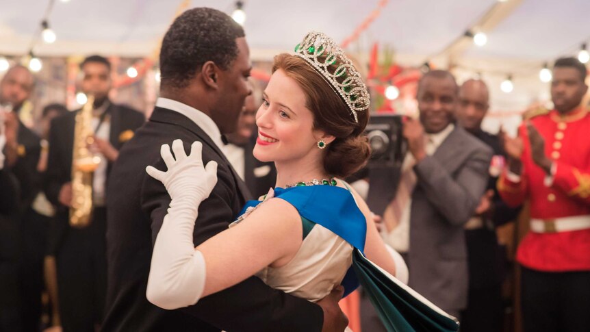 Queen Elizabeth (Claire Foy) and Kwame Nkrumah (Danny Sapani) dance in The Crown.