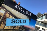 Sold sign in front of property.