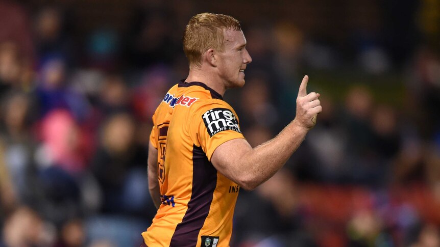 Jack Reed celebrates a try for the Broncos