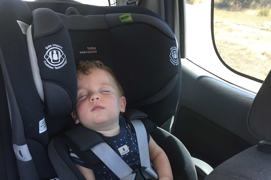 Baby sleeping in a car