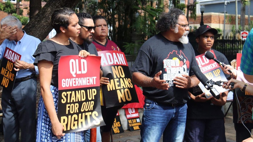 Adrian Burragubba leads a protest against the proposed mine outside Queensland Parliament in Brisbane