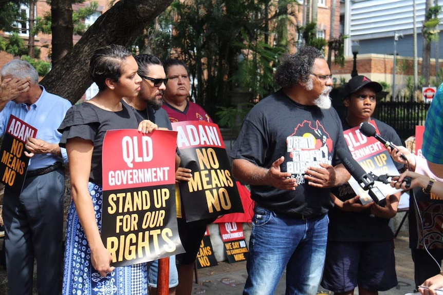Indigenous man Adrian Burragubba leads a protest against the proposed mine outside Queensland Parliament in Brisbane.