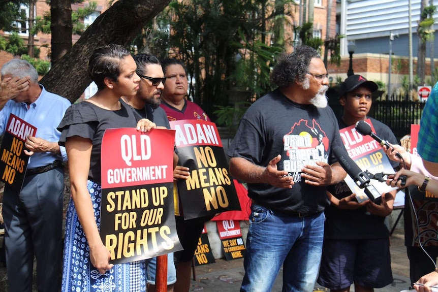 Adrian Burragubba leads a protest against the proposed mine outside Queensland Parliament in Brisbane