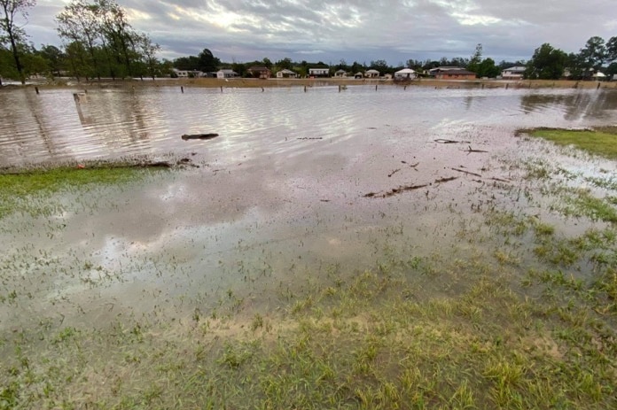 a large amount of water in someone's front yard