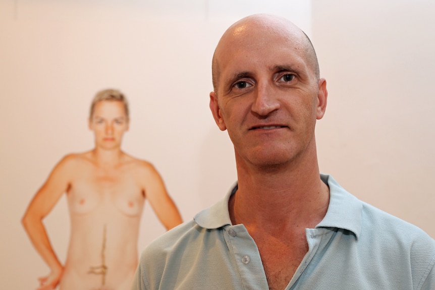 Lismore Regional Gallery director Brett Adlington with Deborah Kelly's photograph of Simone O'Brien