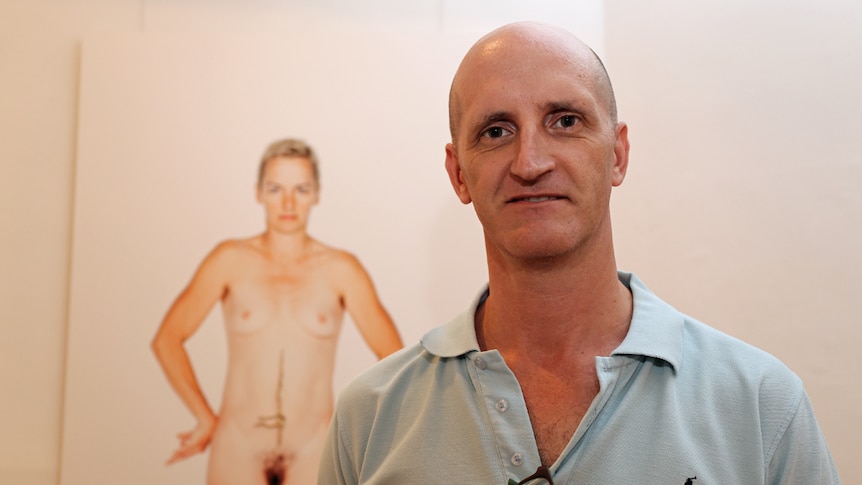 Lismore Regional Gallery director Brett Adlington with Deborah Kelly's photograph of Simone O'Brien