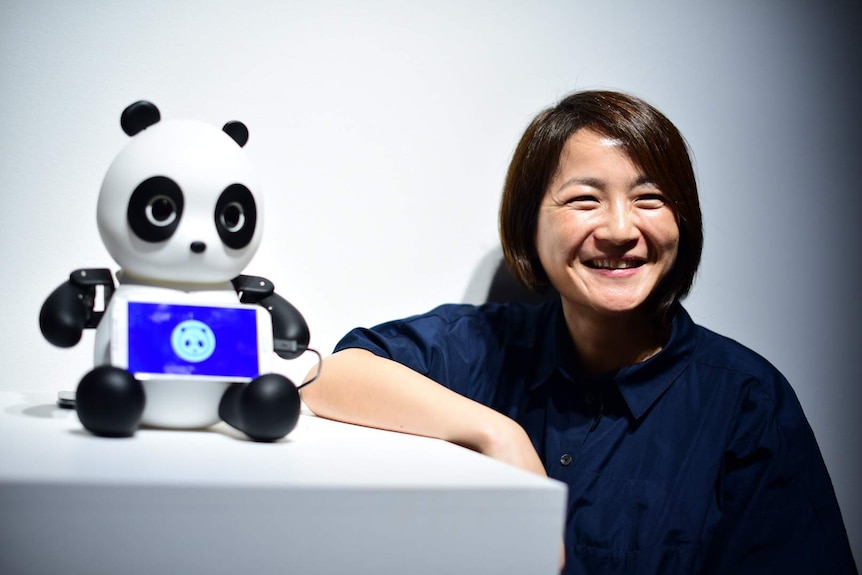 Doo Eun Choi stands next to her Robo Panda.