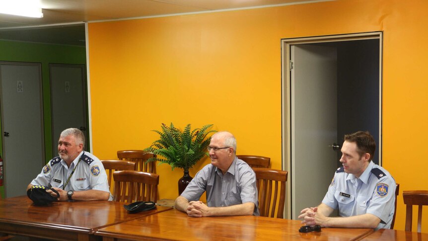 Corrective Services staff Brad Peebles and John Buckley with Commissioner Peter Severin (centre).