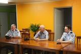 Corrective Services staff Brad Peebles and John Buckley with Commissioner Peter Severin (centre).