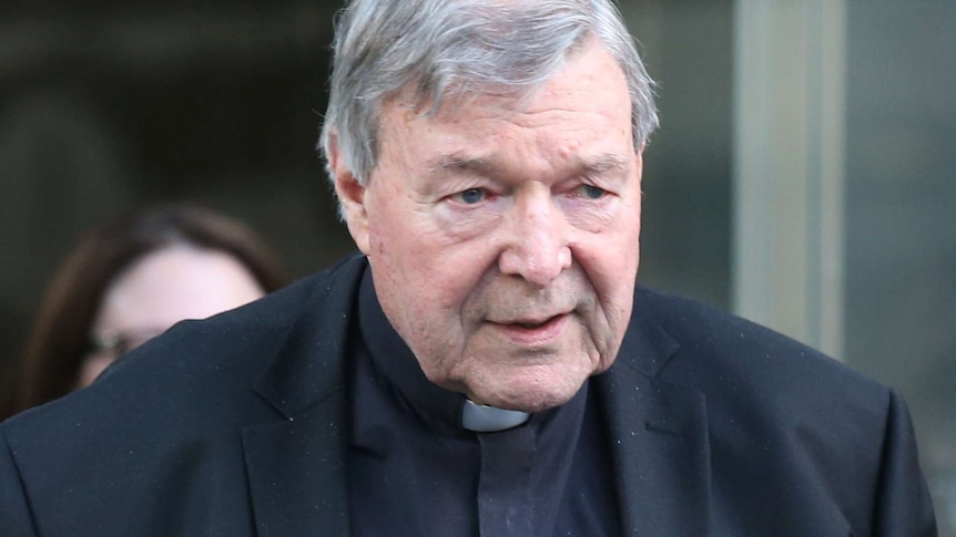 A close up of George Pell in a priest's collar.