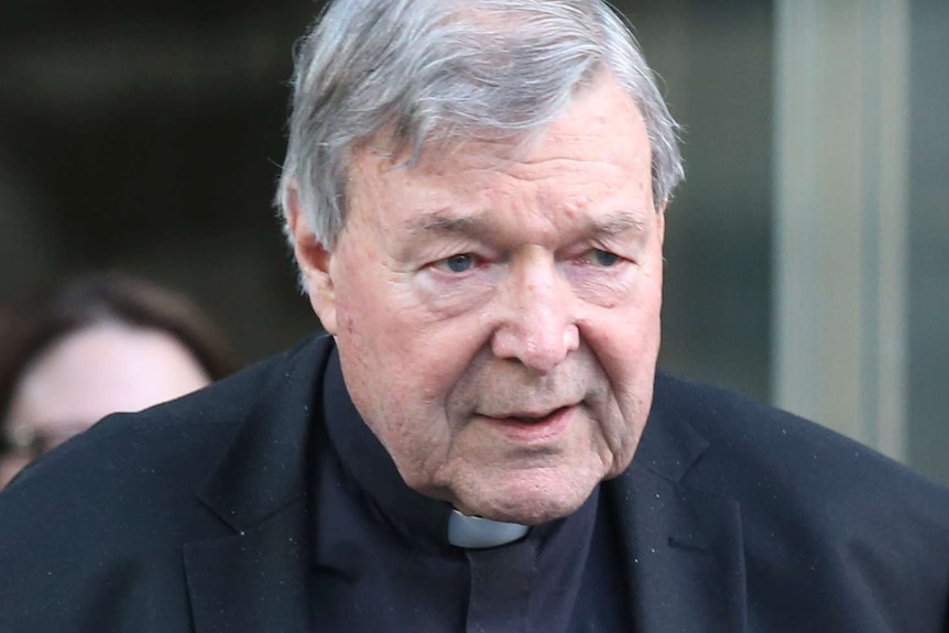 A close up of George Pell in a priest's collar