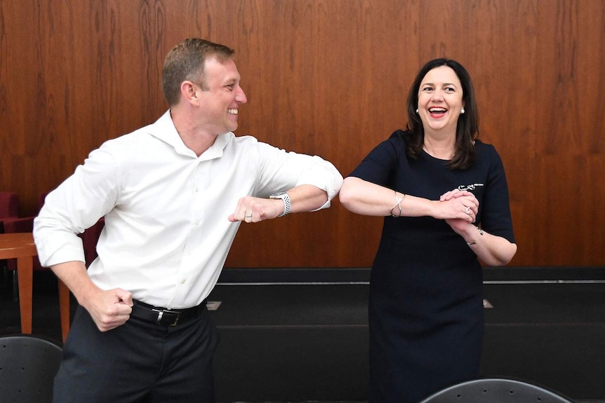 Steven Miles greets Annastacia Palaszczuk with elbow to elbow at Parliament House