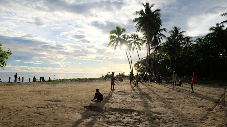 People on a beach in the Solomon Islands. 