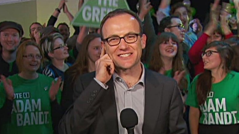 Adam Bandt speaks in front of supporters after retaining his seat.